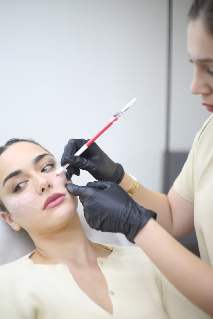 Victoria performing a facial mapping assessment at CosmeticXco